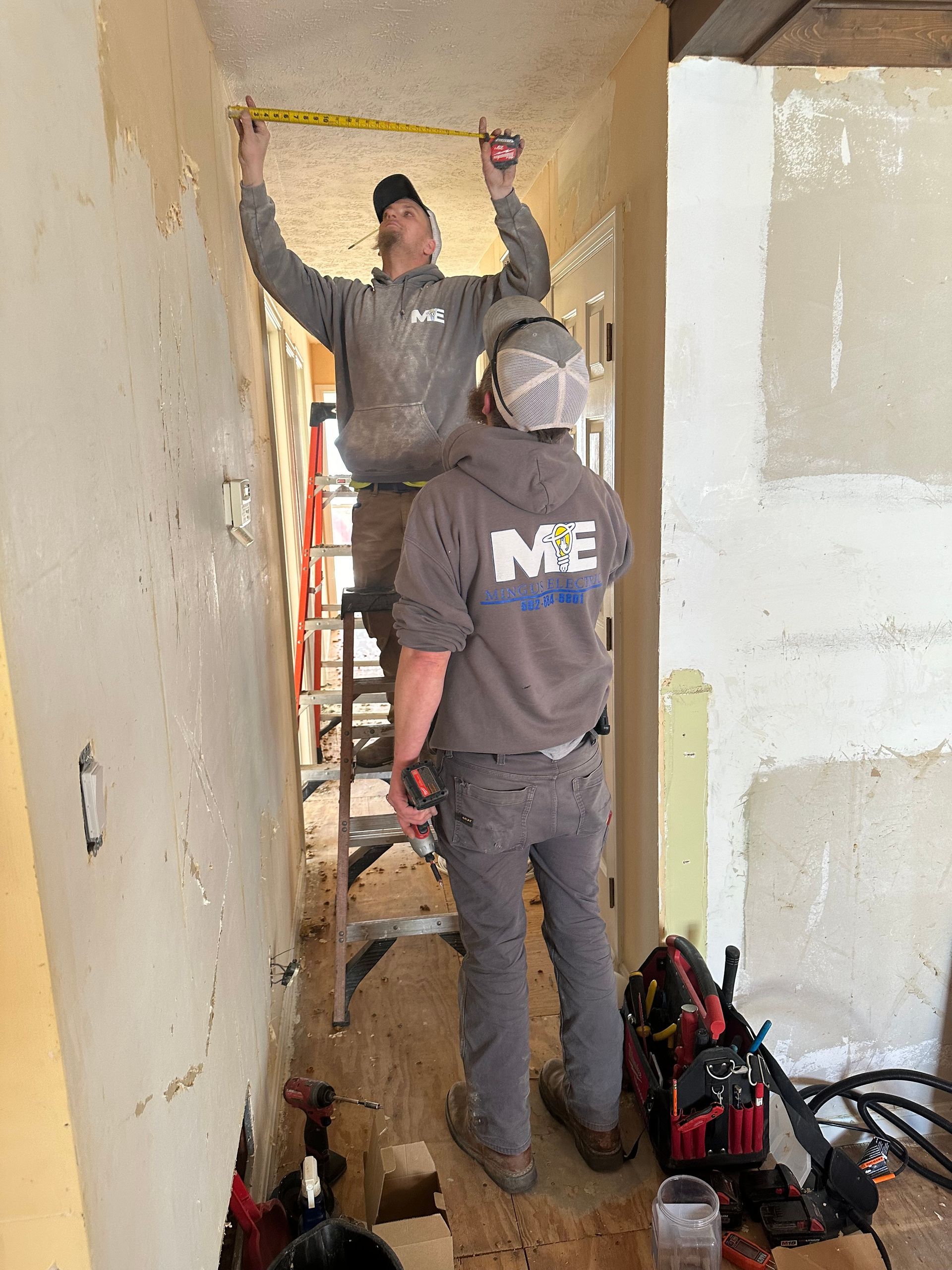 A Mingus Electric licensed electrician conducting electrical work in Louisville, Kentucky.