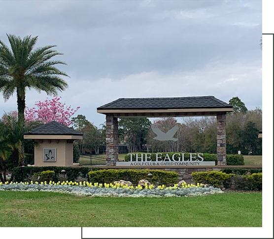 A sign for the eagle golf club and gated community