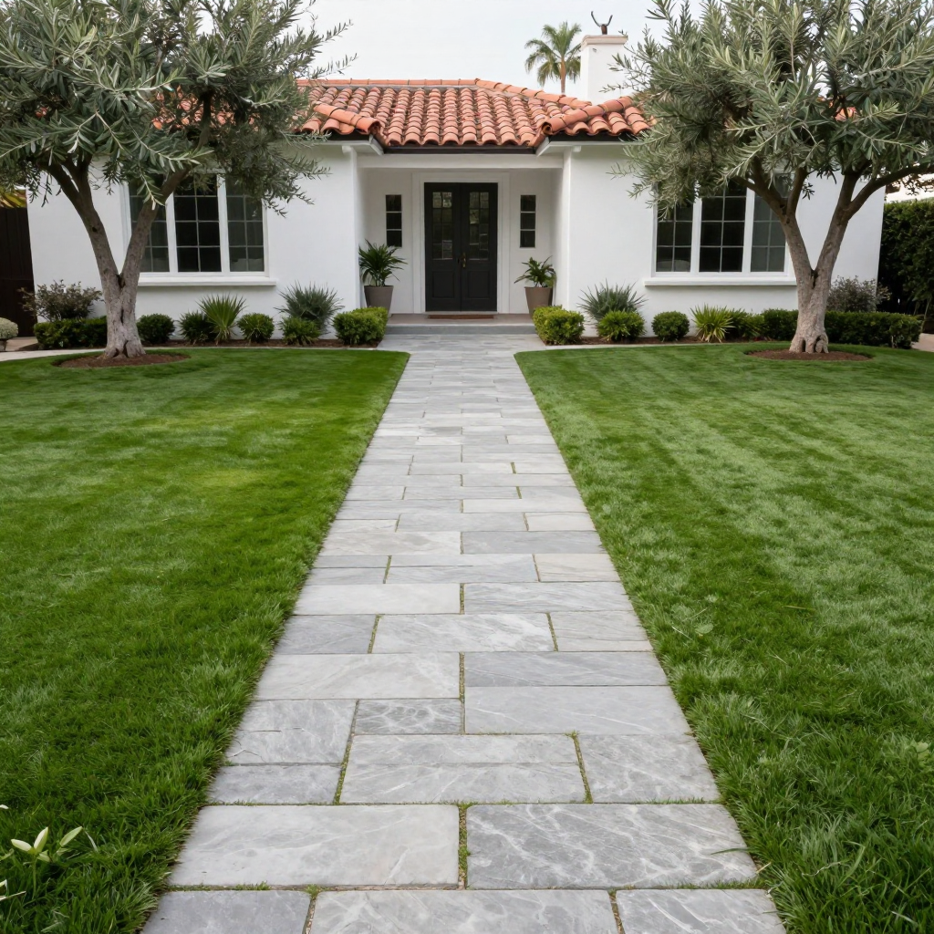 Stone path leads to a white house with a red tile roof; trees and green lawn flank the path.
