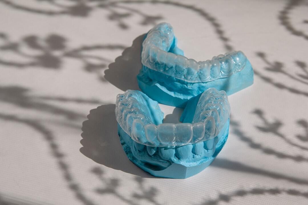 A pair of dental braces sitting on top of each other on a table.