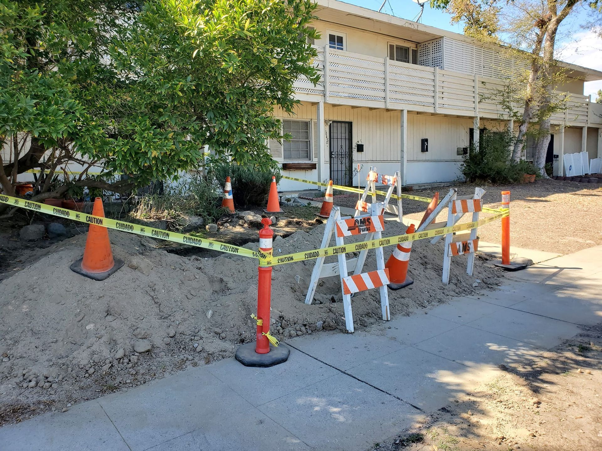 A building with a lot of cones and barriers in front of it.