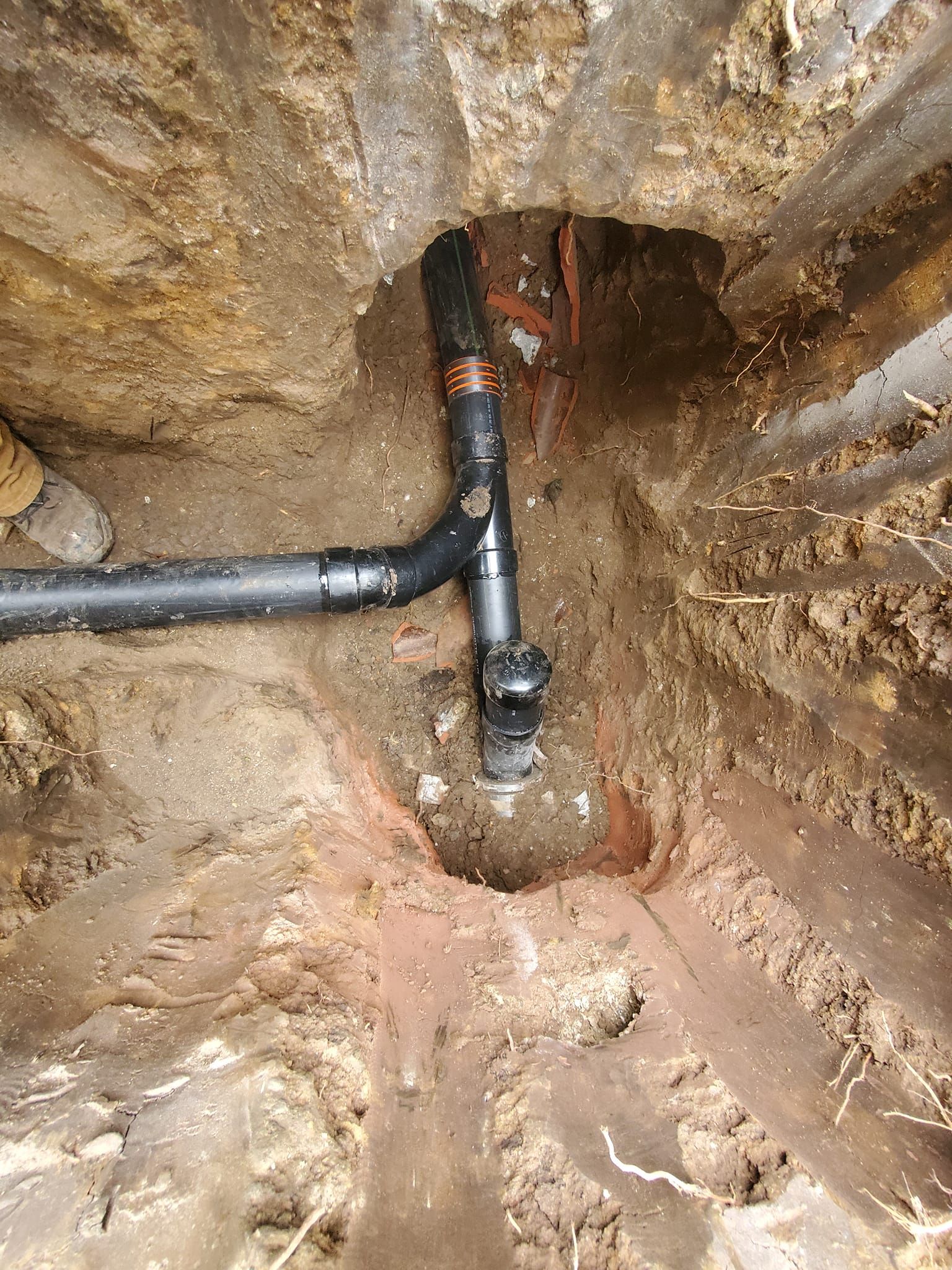 A close up of a pipe in a basement.