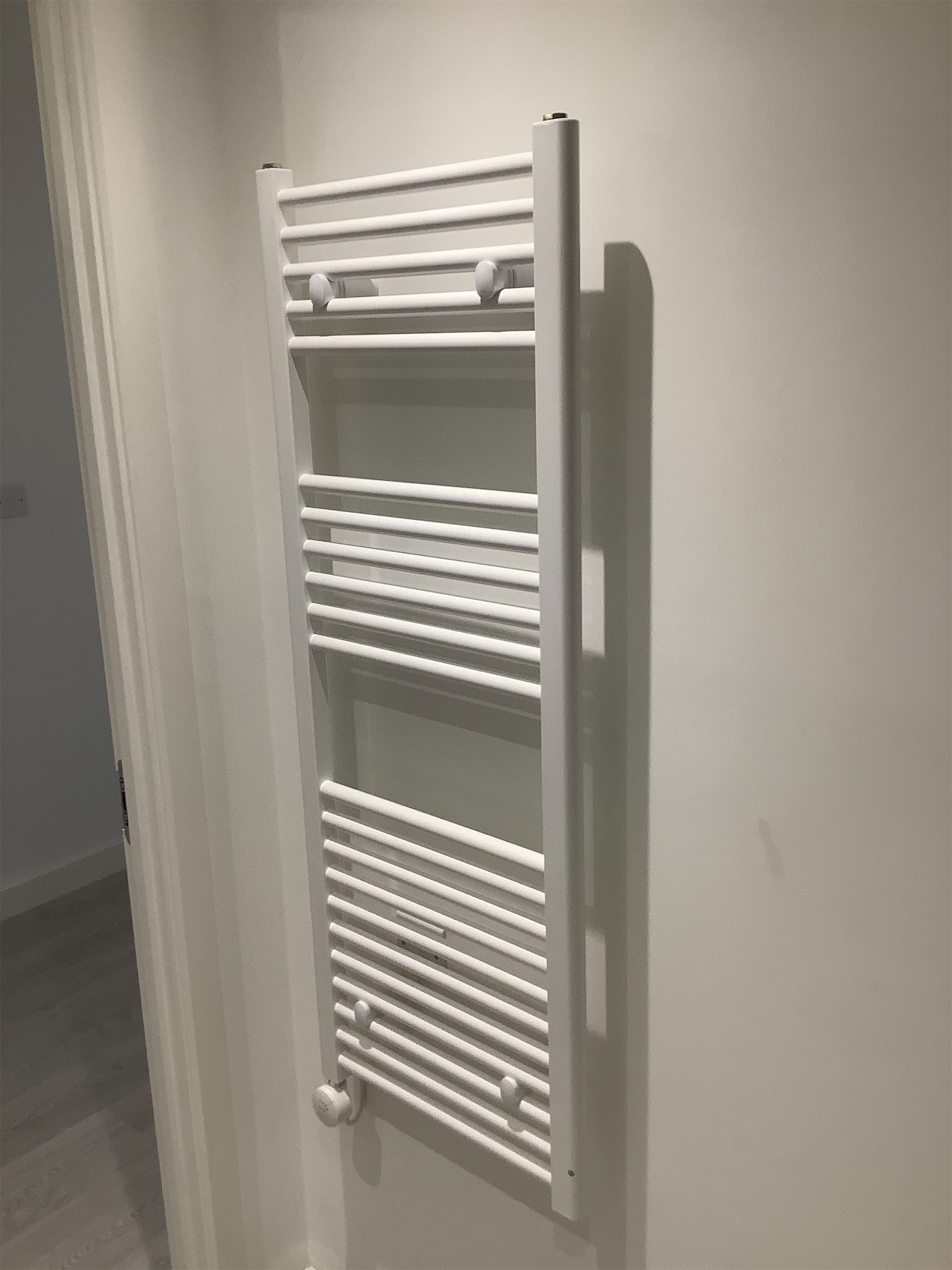 Heated towel rail fitted in bathroom – inventory documentation