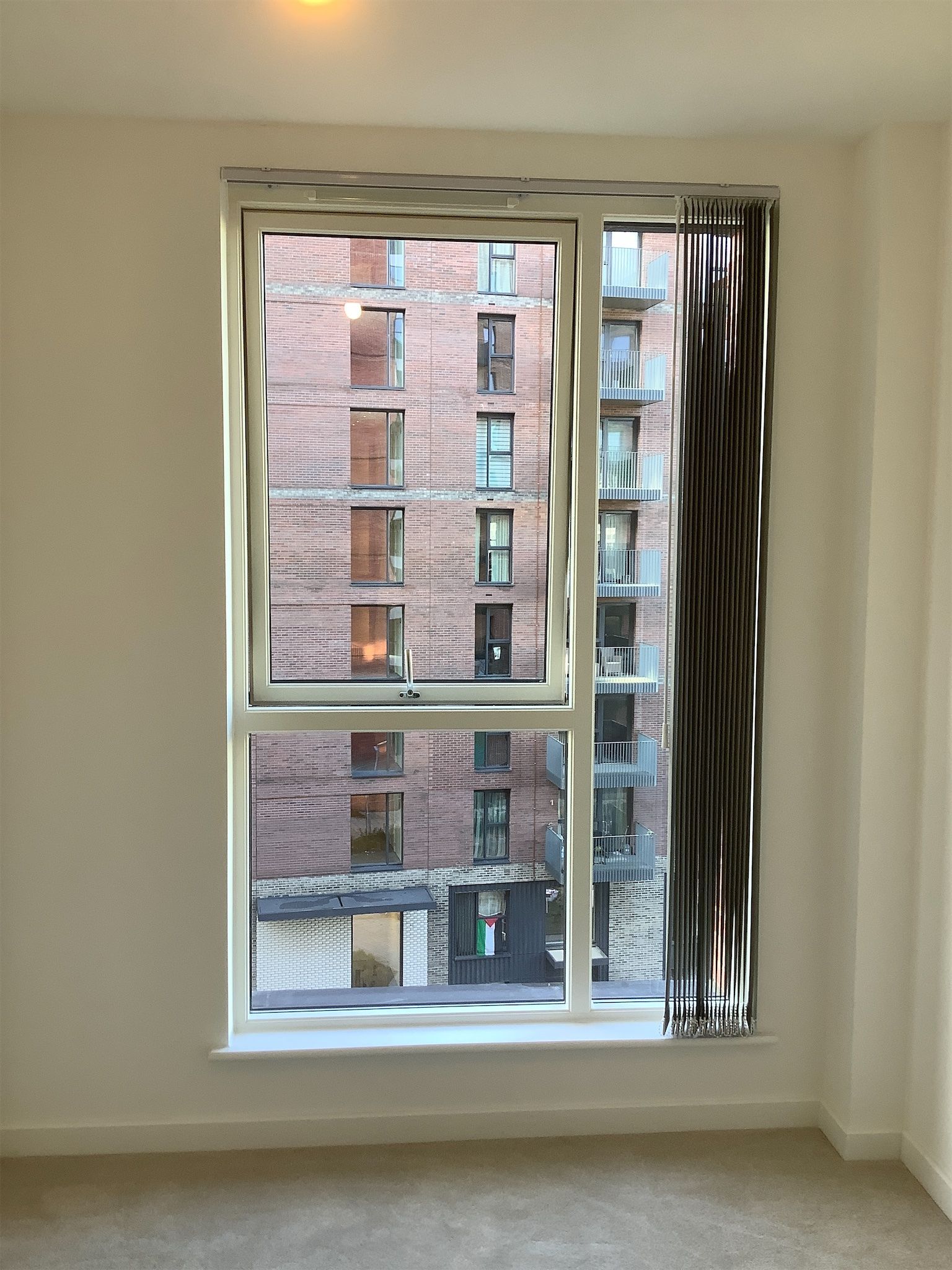 Bedroom window with slatted blind recorded in inventory report