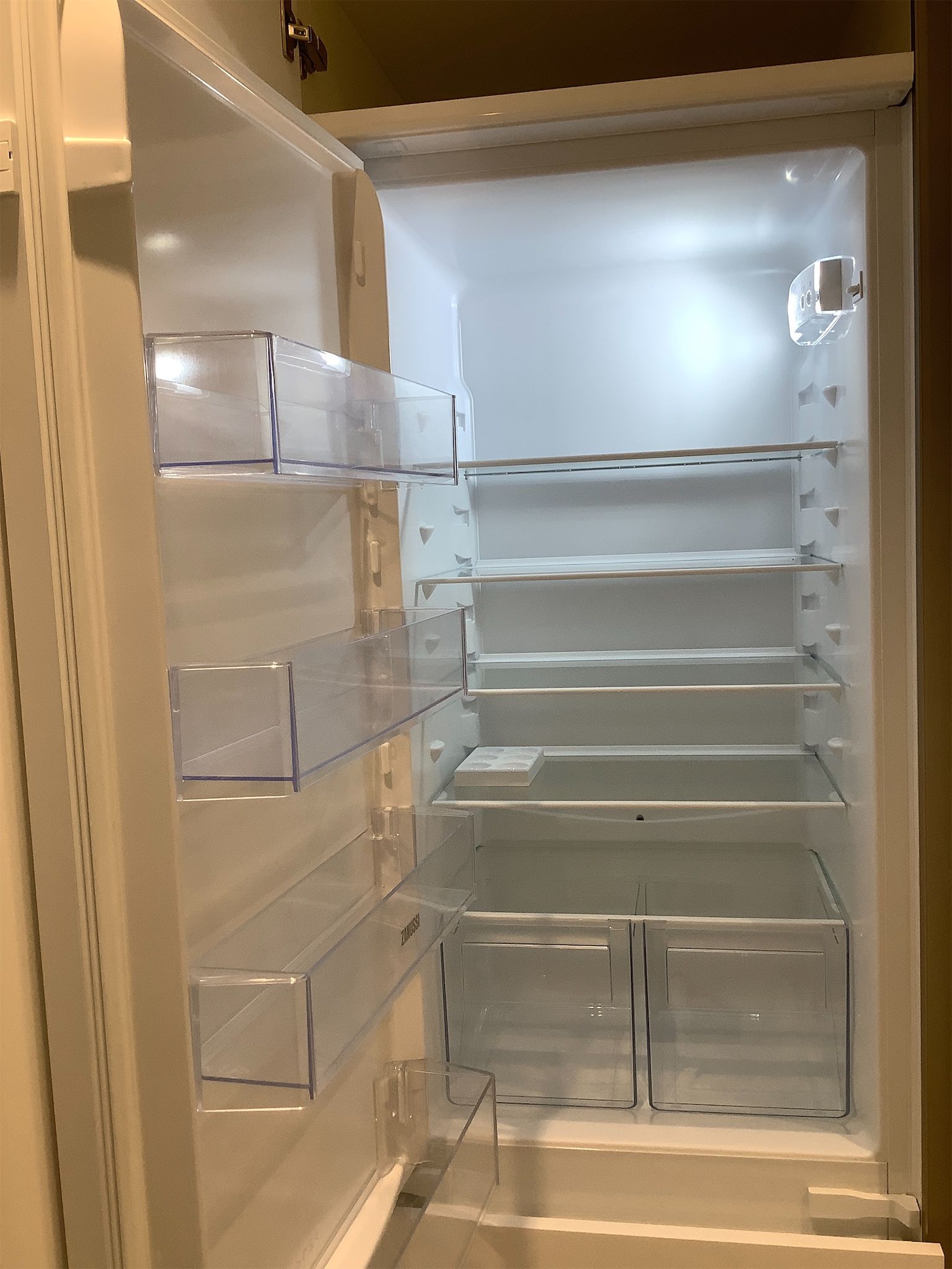 Fridge interior photographed to document cleanliness and condition
