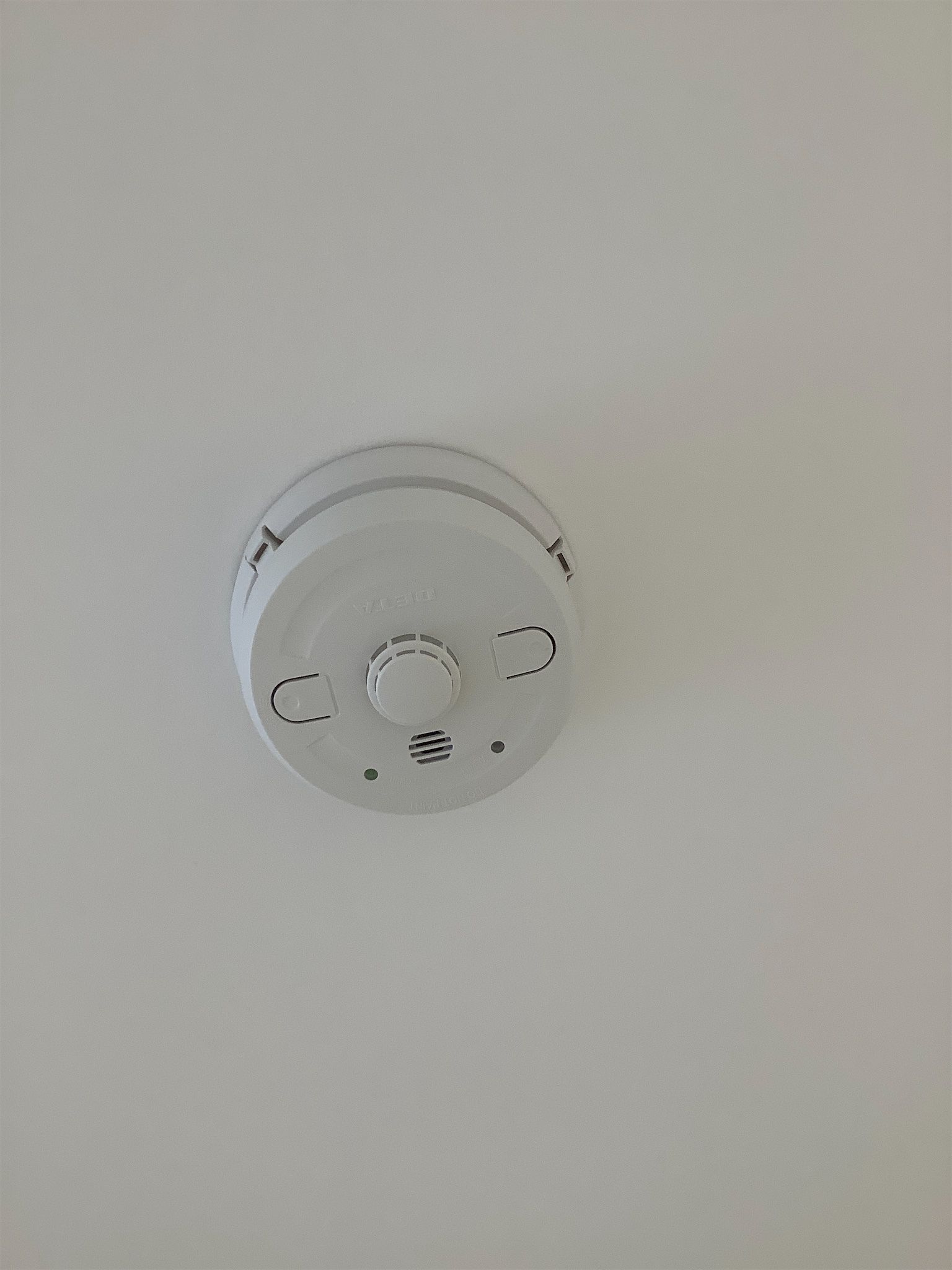 Ceiling-mounted heat alarm in kitchen – safety feature photographed