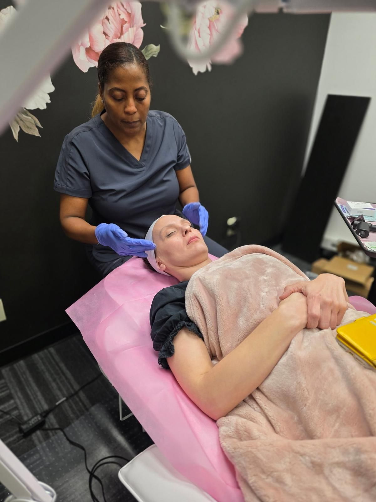 Woman receiving a facial treatment; 