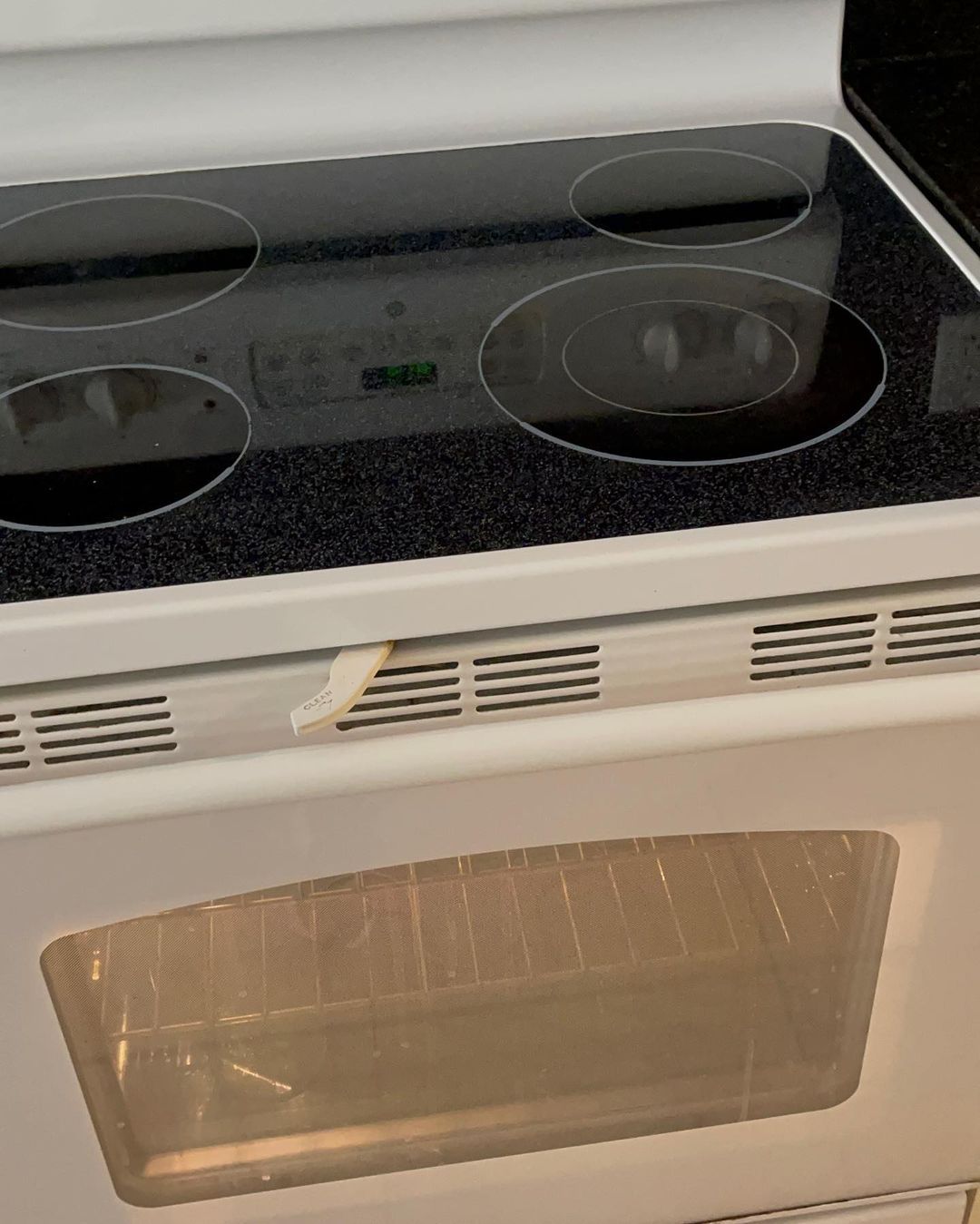 A close up of a stove top oven with the door open