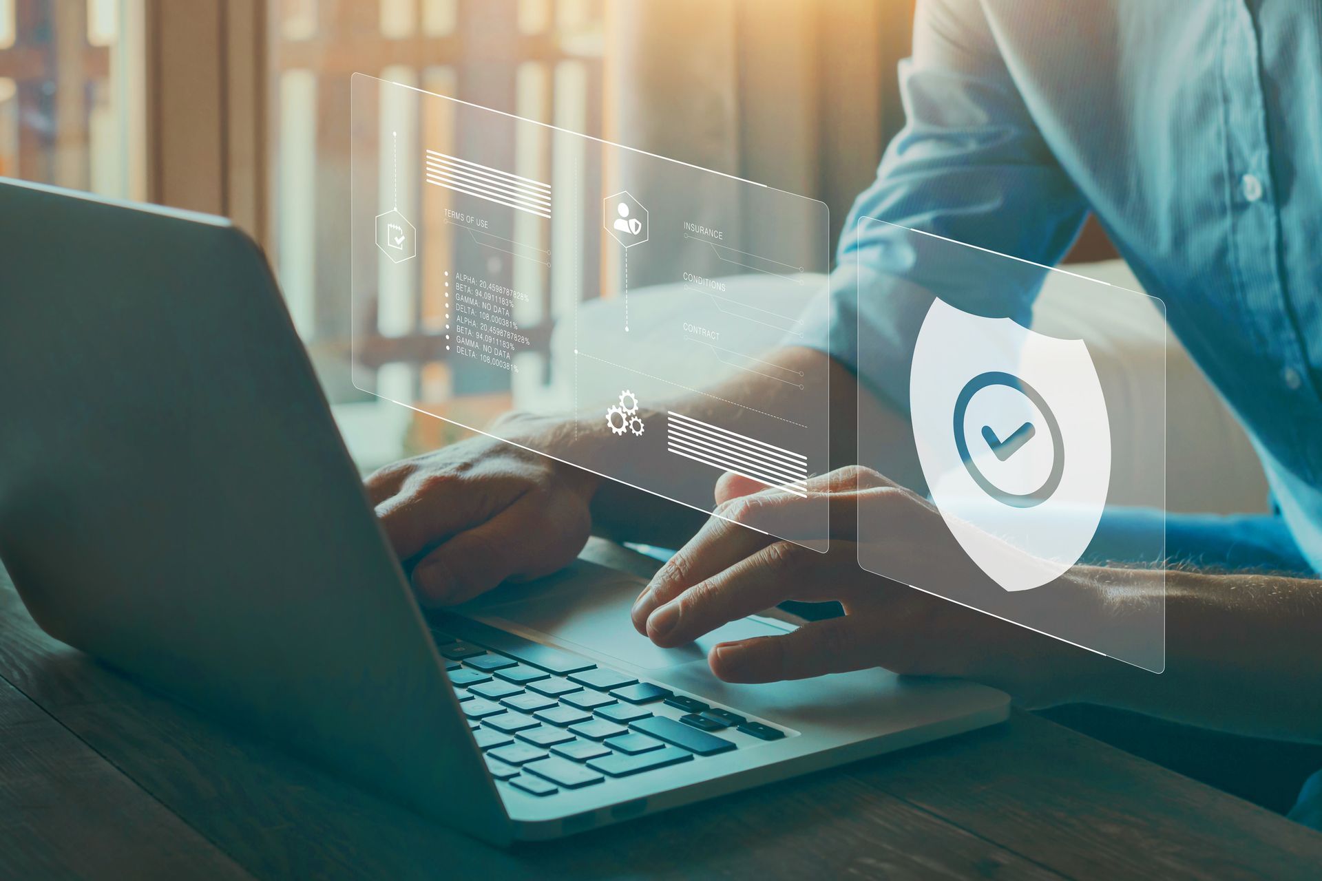 Modern workspace with virtual security graphics highlighting the need for business insurance.