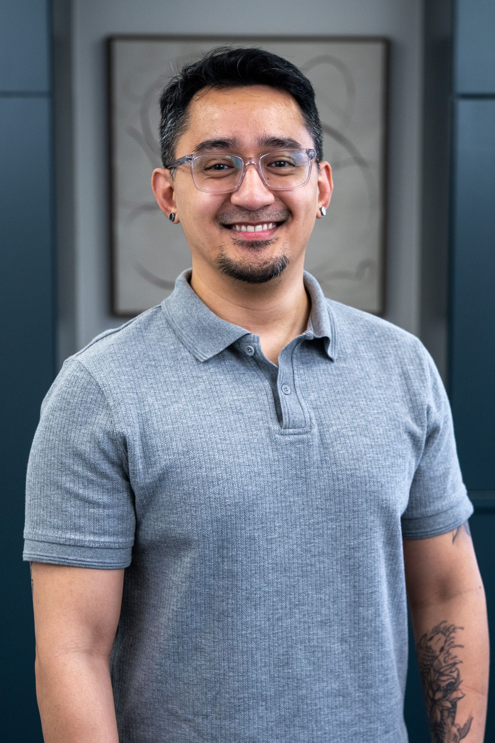 A man stands in front of a sign that says evolve brain