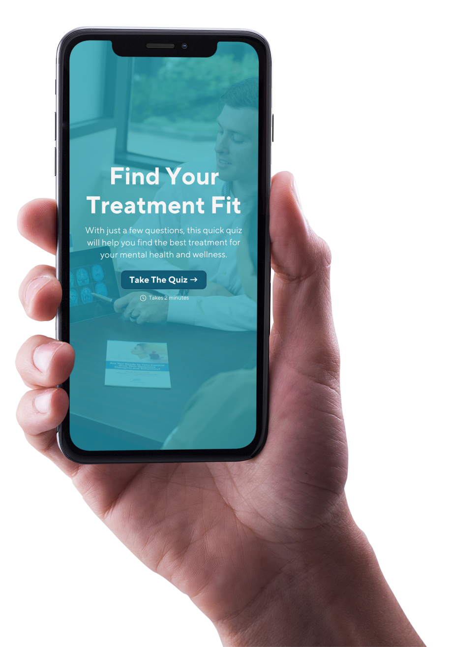 A hand is holding a cell phone that says find your treatment fit