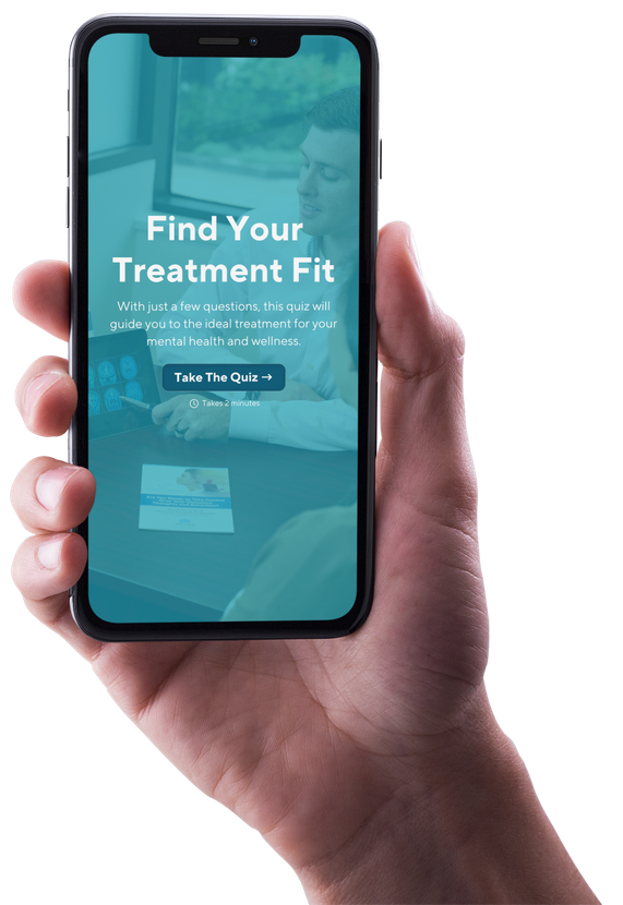 A hand is holding a cell phone that says find your treatment fit on the screen.