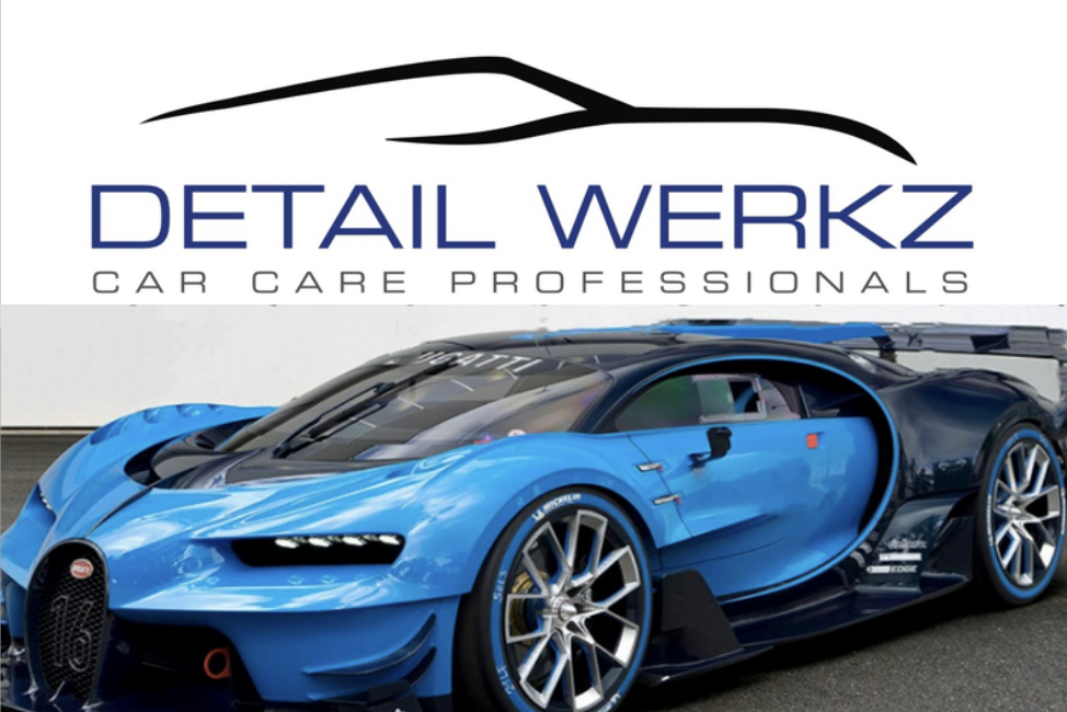 Hand wearing black glove wiping a gray car's hood with a blue cloth.