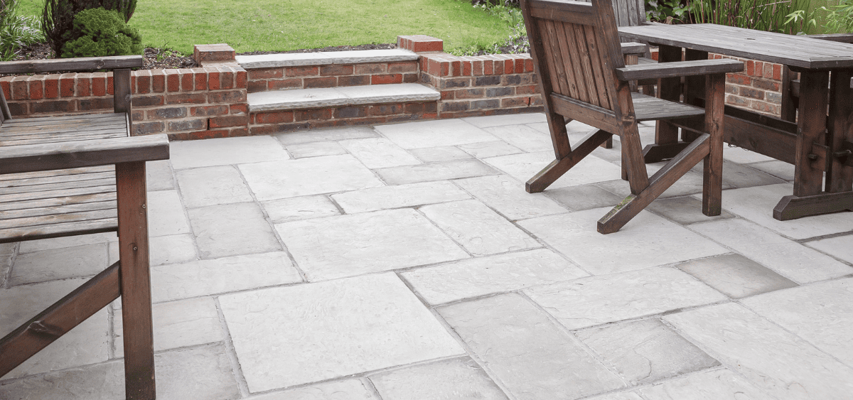 An elegant natural stone patio in a backyard in Louisville