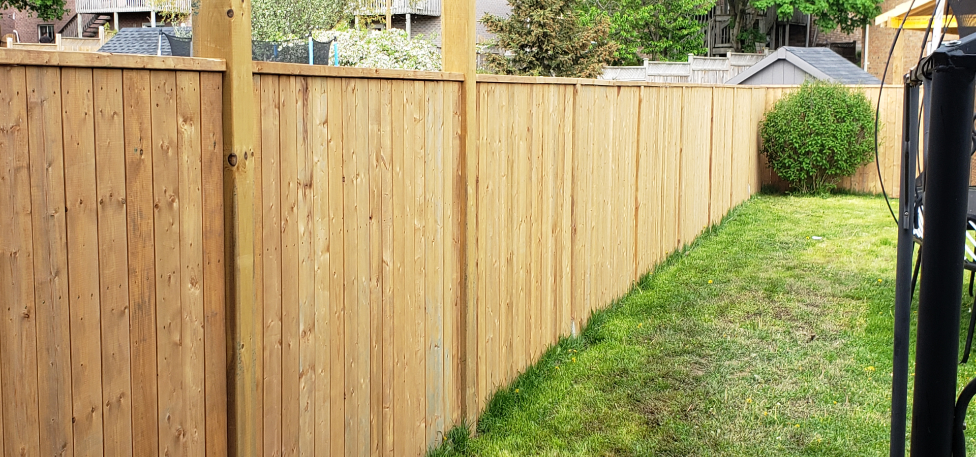 Wooden privacy screen installed by Louisville Landscape Pros