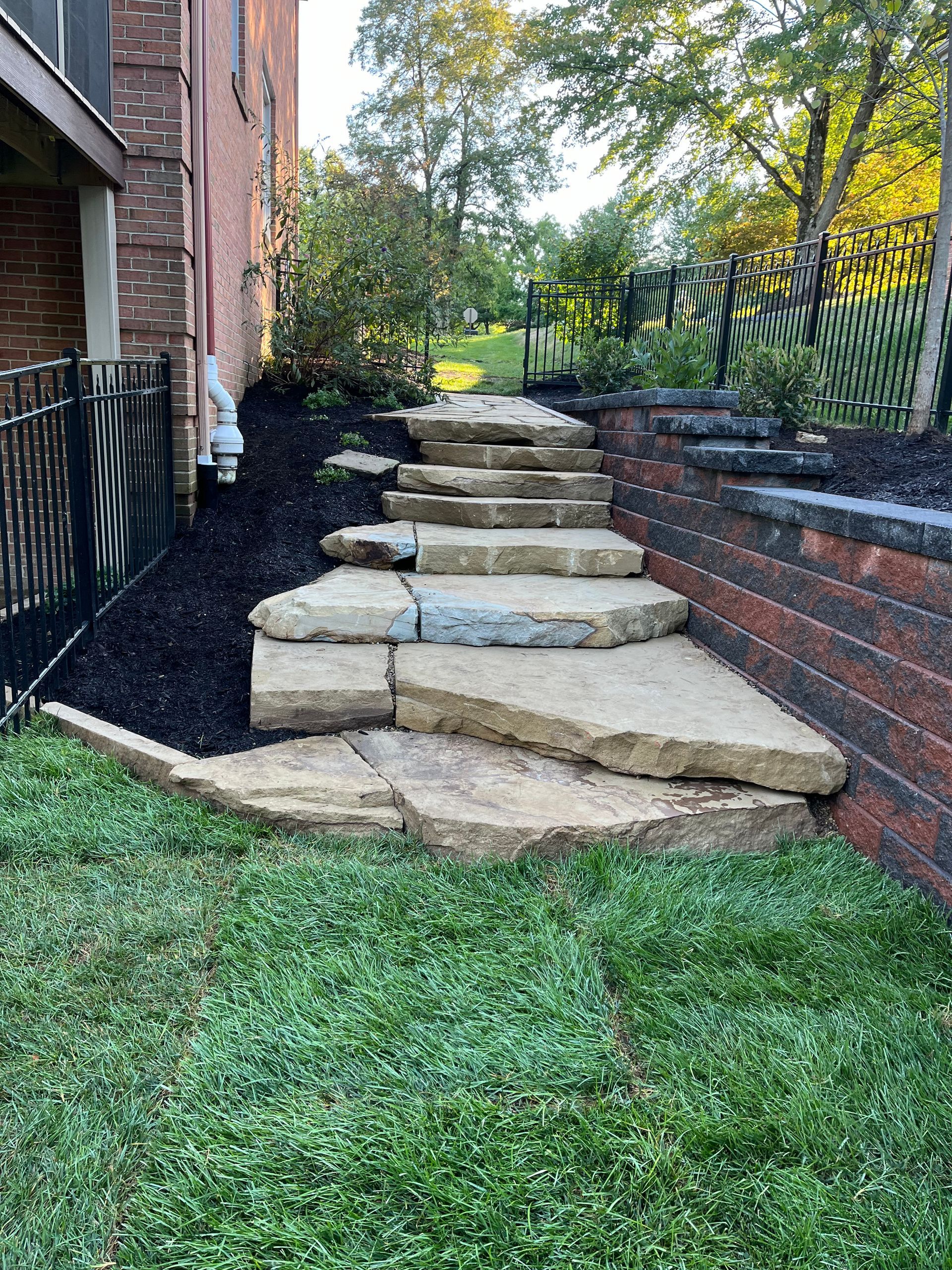 A set of stone steps leading up to a house.