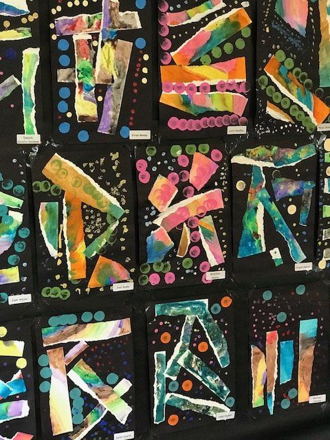 A bunch of colorful letters on a black background