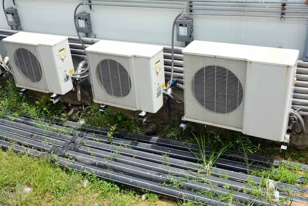 A White Air Conditioner Is Hanging From The Ceiling — Jordan Wheatland Air Conditioning & Refrigeration In Parkes, NSW
