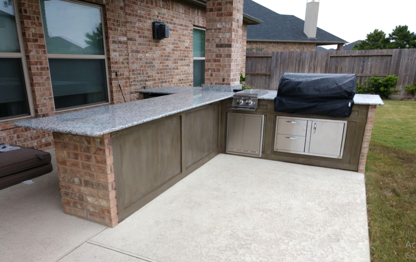 A backyard with a pergola and chairs in it