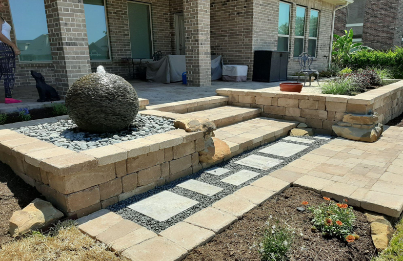 A patio with a table and chairs under an umbrella