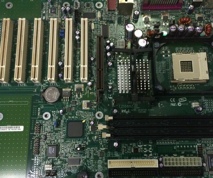 A close up of a motherboard with the word intel on it