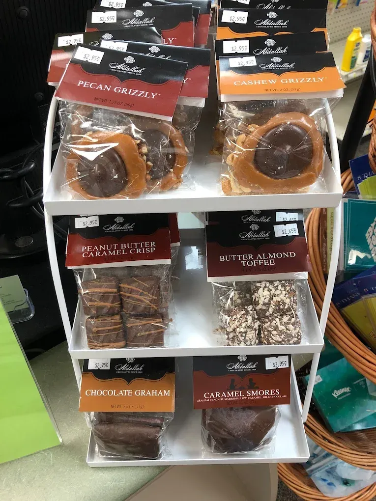 A shelf with a variety of candy on it