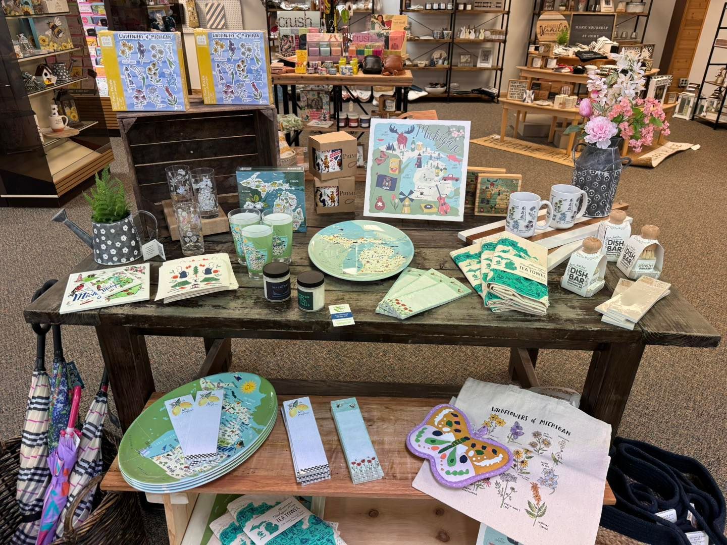 A table with a variety of items on it in a store.