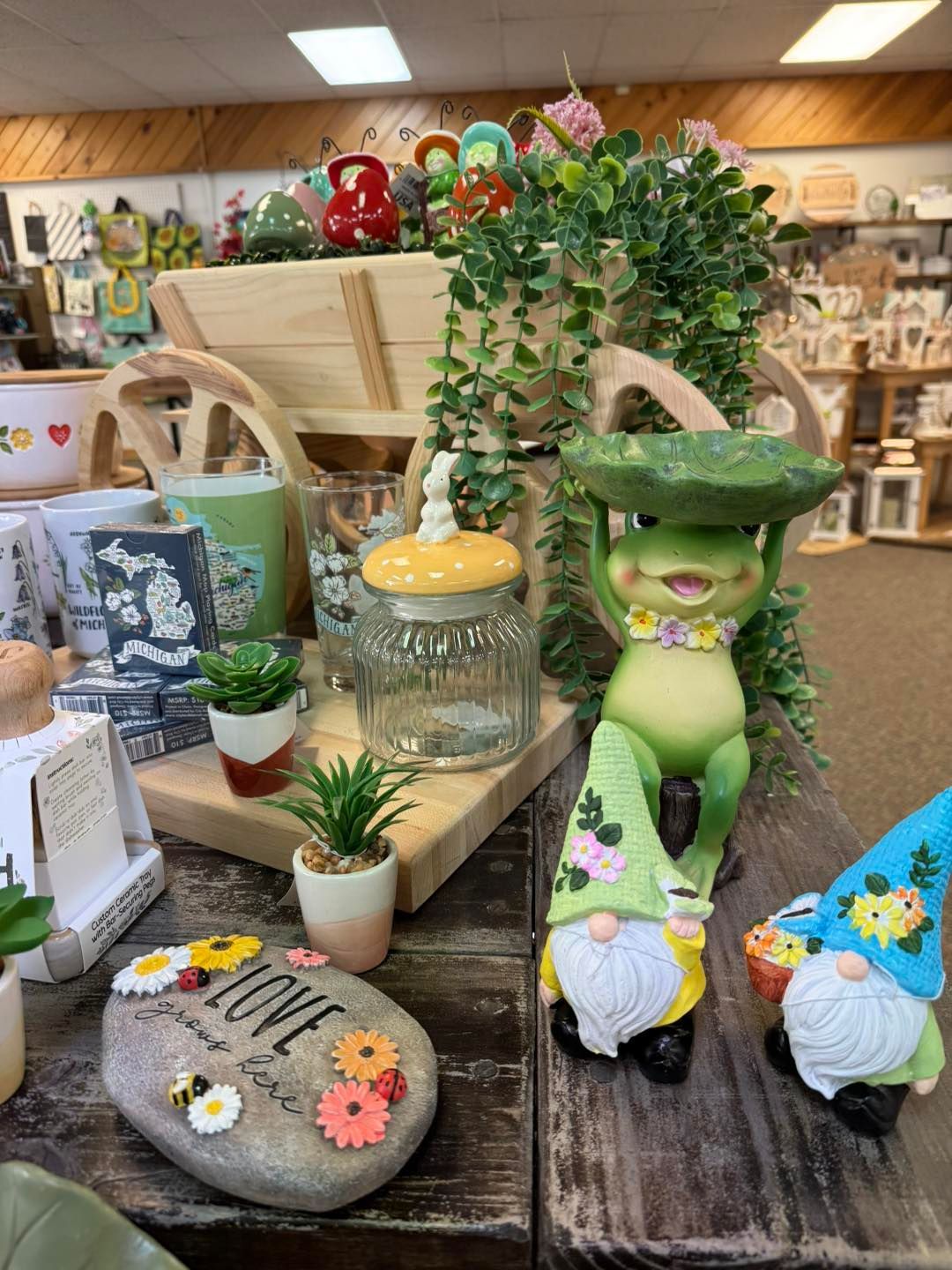 A store filled with lots of gnomes and plants.