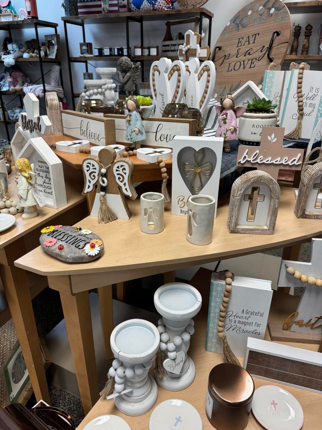 A table with a lot of decorations on it in a store.