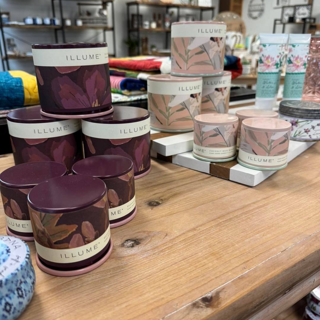 A wooden table with a bunch of candles on it