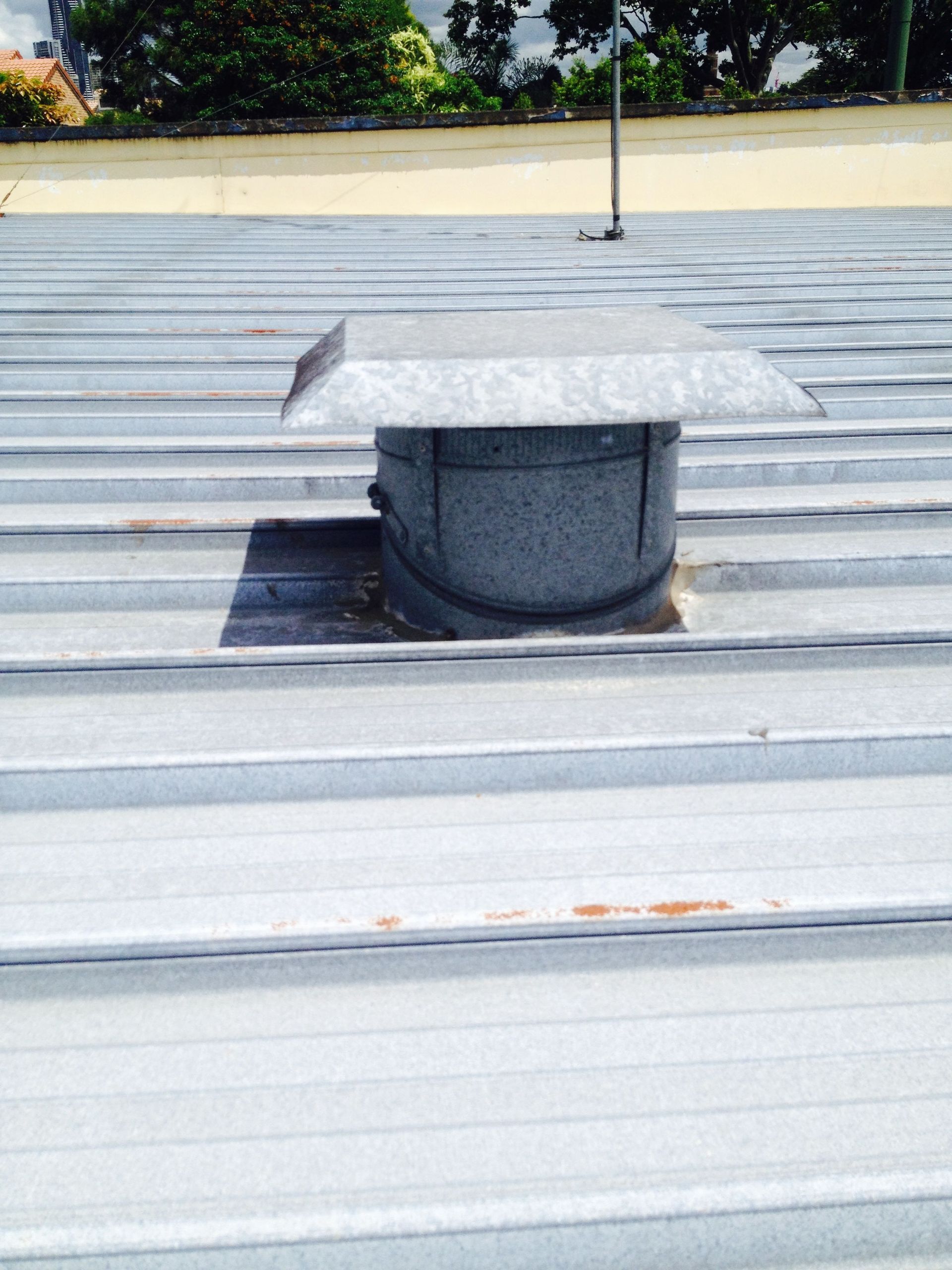 Metal roof with a vent cap.