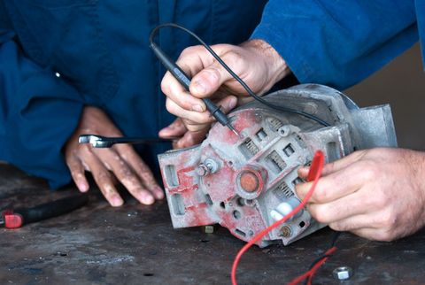 Mechanics fixing car parts in Oamaru