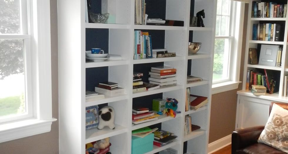White Built-In Bookshelves Filled with Books