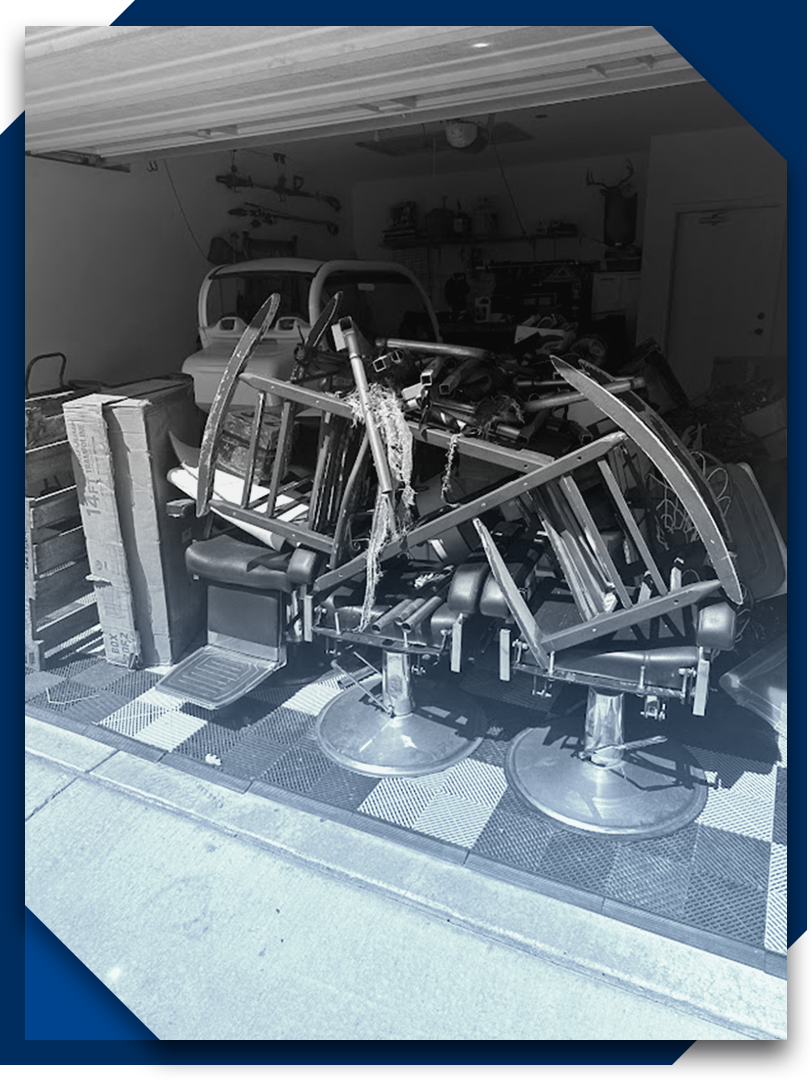 A bunch of chairs are sitting in a garage