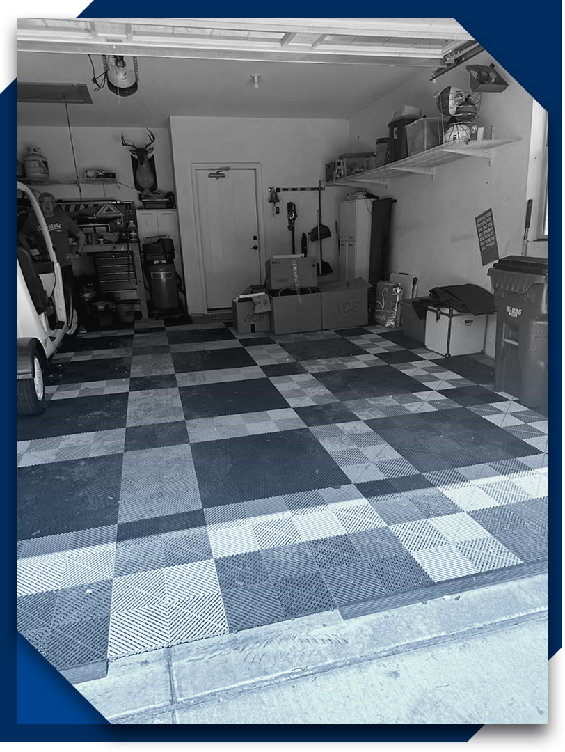 A black and white photo of a garage with a checkered floor