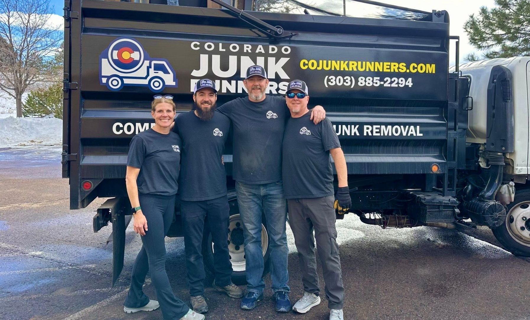 The Colorado Junk Runner team standing in front of their truck