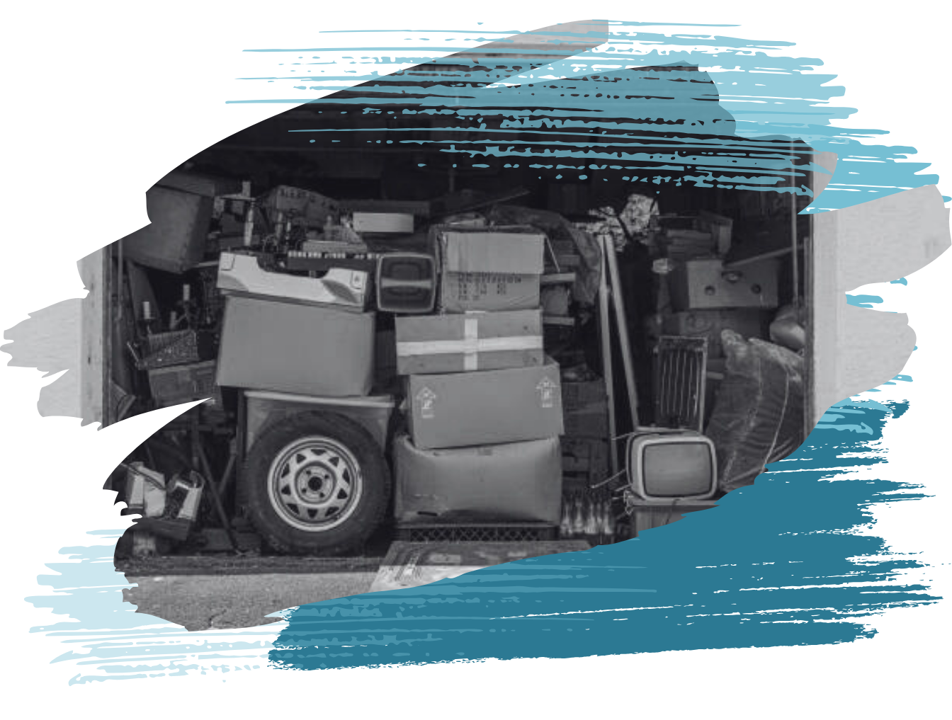 Garage overflowing with boxes, tires, and various items.