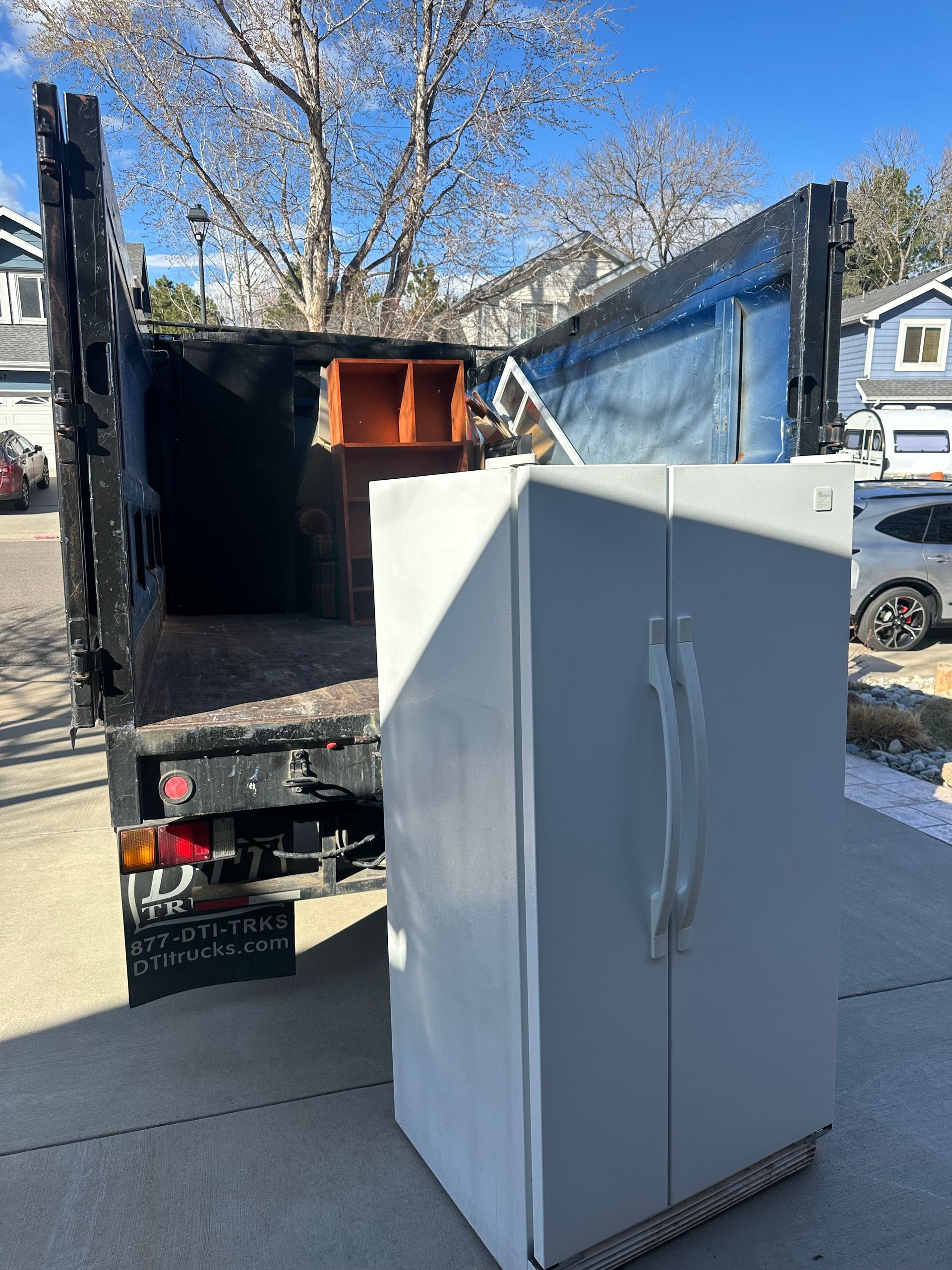 Refrigerator removal service in Louisville, CO by Colorado Junk Runners during residential junk removal job.