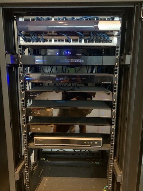 A server rack with a lot of electronics on it