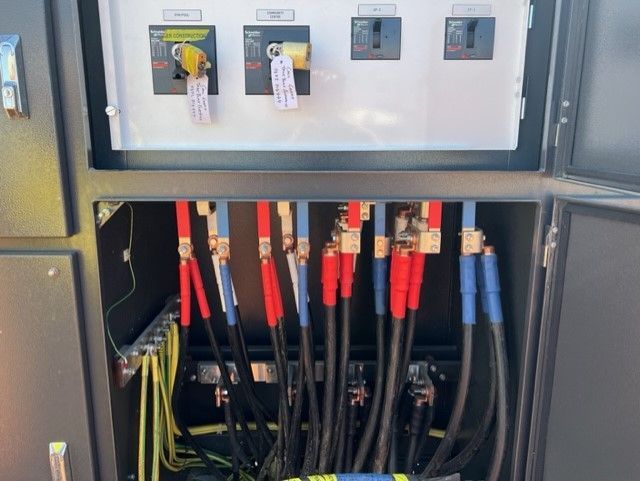 A bunch of wires are coming out of a box