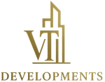 Gold &ldquo;VII Developments&rdquo; logo with stylized skyscraper line art on a white background
