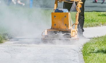 An asphalt paving company employee at work in St. Louis, MO
