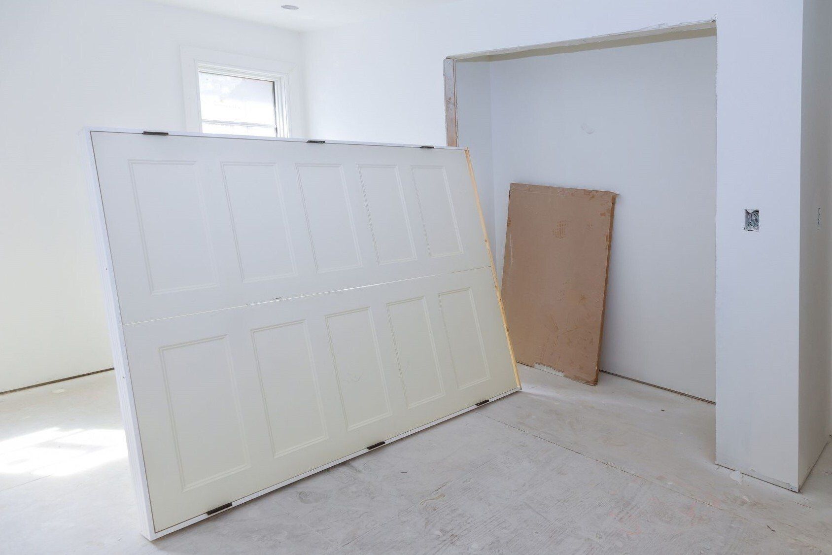 New closet doors being installed by Bellingham handyman