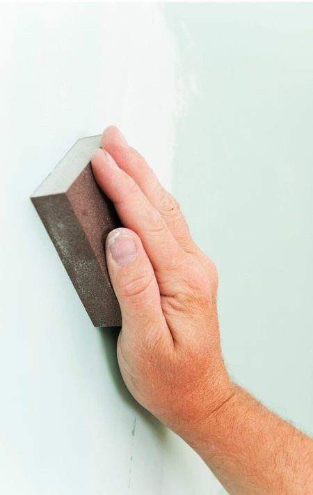 Bellingham Handyman Sanding green wall