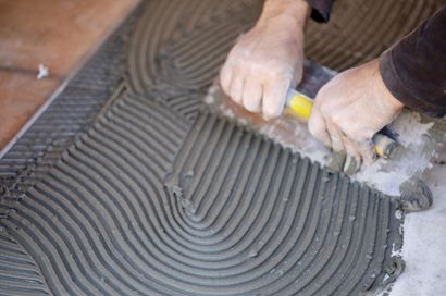 Bellingham Handyman installing new tiles on floor