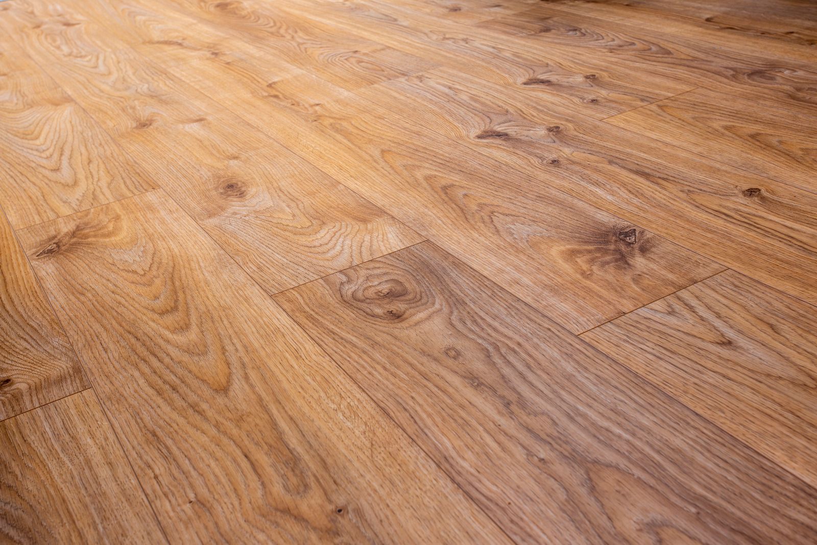 A close up of a wooden floor in a room.