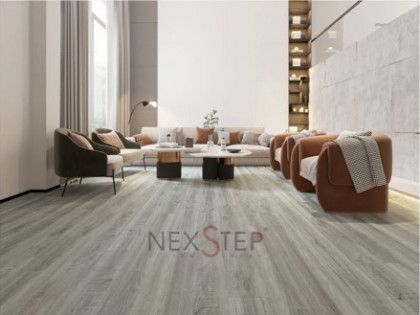 A living room with a couch , chairs , and a table.