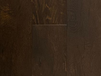 A close up of a dark brown wooden floor.