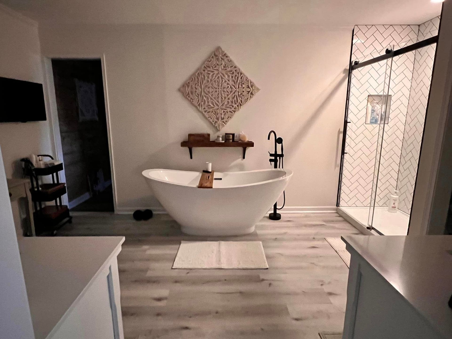 A bathroom with a bathtub and a shower.