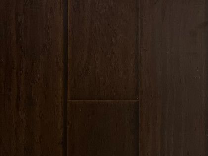 A close up of a dark brown wooden floor.